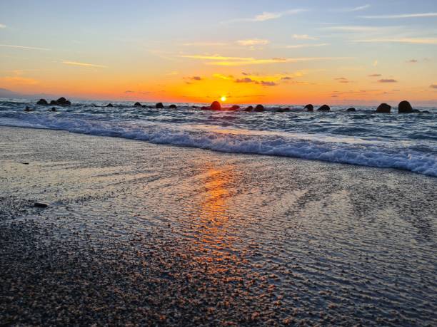 istock sunset over the calm sea on a beautiful day 2184155058