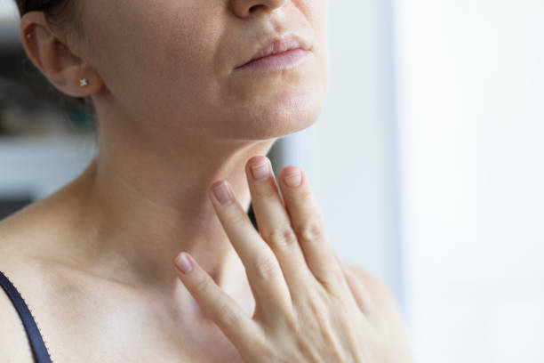 istock Woman touching wrinkles on her neck, closeup. 2184160696