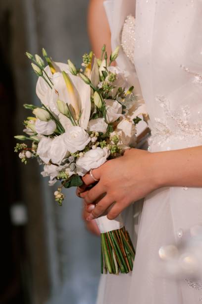 istock Bride holding elegant wedding bouquet 2184164054