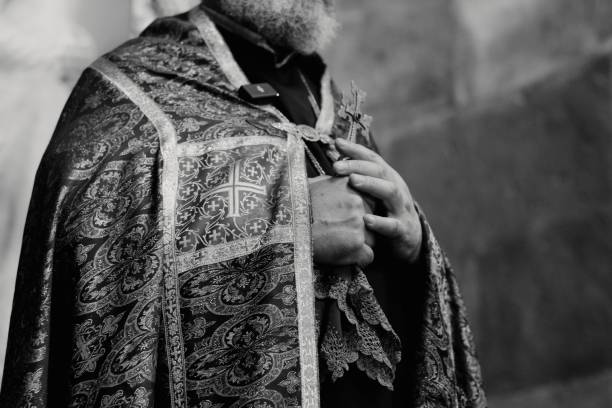 istock Religious figure in ornate vestments holding a cross. 2184164071