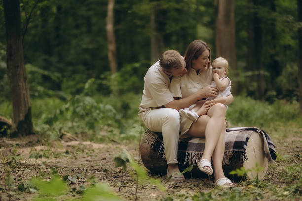 istock Parents playing with a child in the forest 2184164434