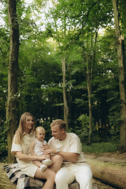 istock a young family on a walk in the woods 2184164435