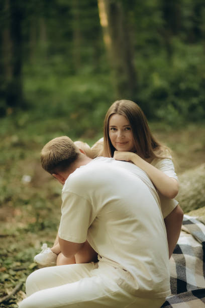 A happy family spends time in the forest