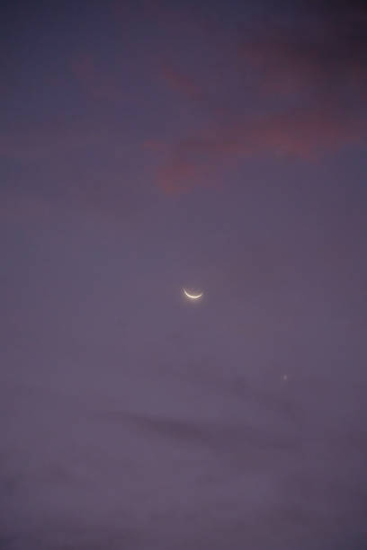 istock Waxing crescent moon shining with colorful cloudy sky at dawn 2184165163