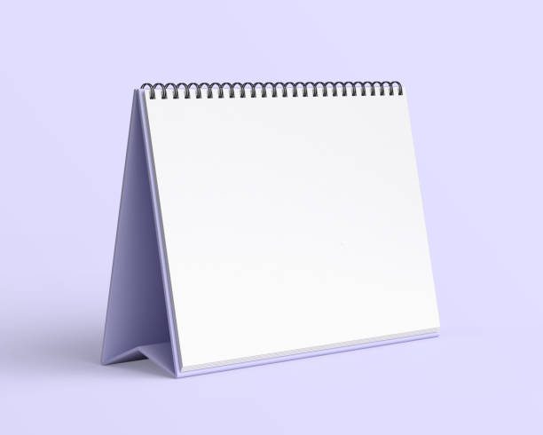 istock Empty desk calendar mockup on light purple background. 2184165511