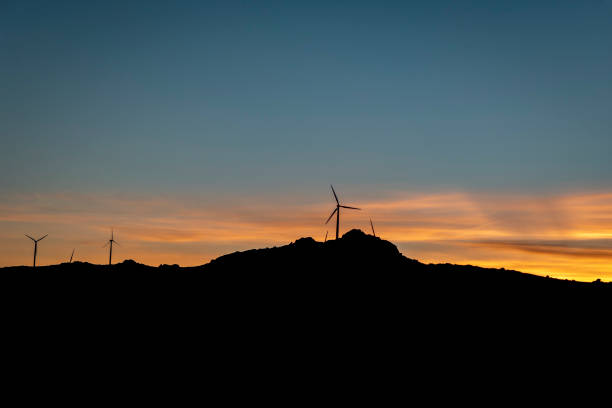Wind turbines in the mountainous landscape at sunset in Portugal