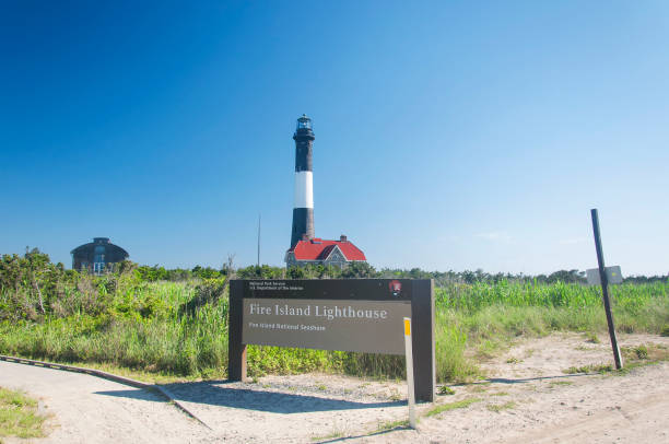 The historic landmark fire island light house on long island new york on a sunny day.
