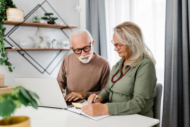 istock Senior couple shopping at home 2184167441