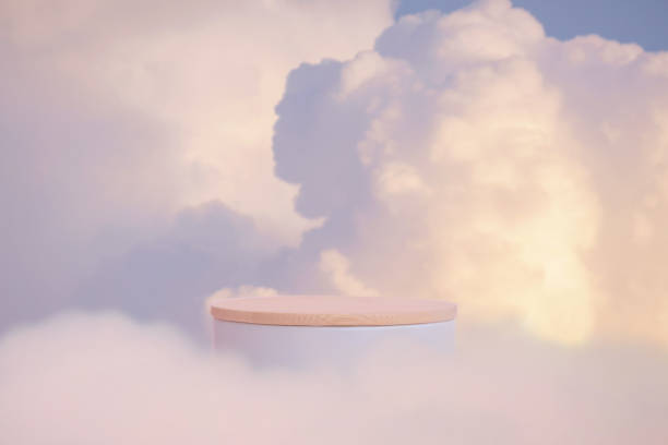 istock Minimal podium tabletop outdoor on blue sky pink clouds with empty space.Beauty cosmetic product placement pedestal present promotion minimal display,summer paradise dreamy concept. 2184169417