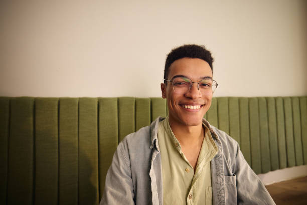 istock A photo of a guy sitting and smiling 2184170289