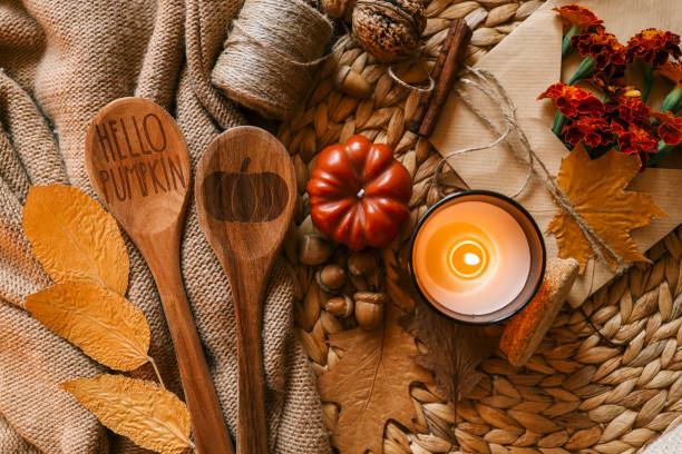 istock Burning candle in a cozy warm homey autumn atmosphere 2184172850