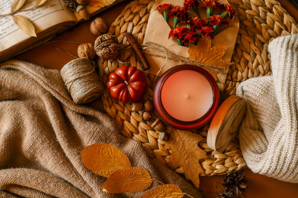 istock Candle in a cozy autumn atmosphere, top view 2184172926