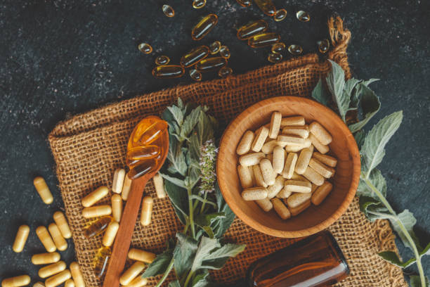 istock Natural vitamins organic on dark background 2184173883