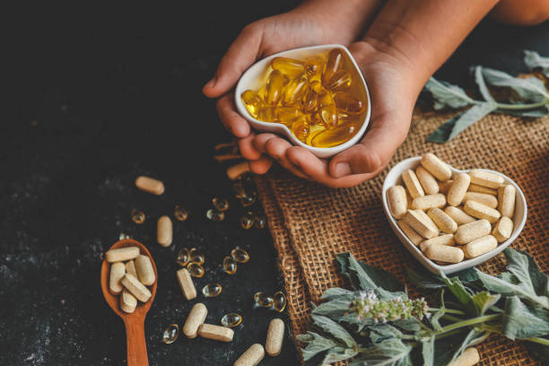 istock Natural organic vitamins in hands close-up 2184173887