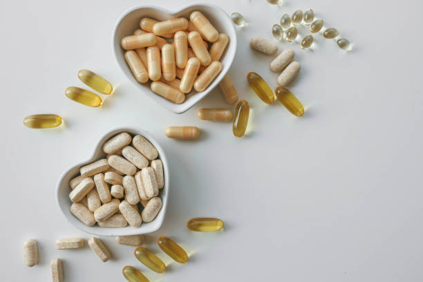istock Tablets and vitamins on white background, banner advertising, pharmaceuticals 2184174624