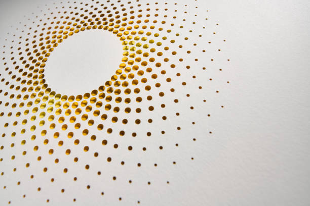 istock Elegant perforated paper artwork with circular gradient dot pattern in warm yellow and orange tones on white background 2184176129