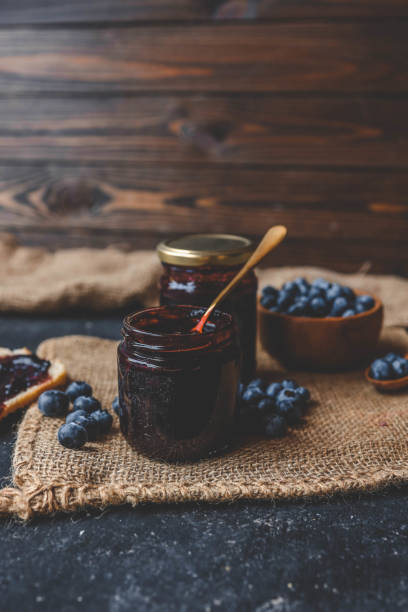 istock Delicious organic blueberry jam on dark background 2184176655
