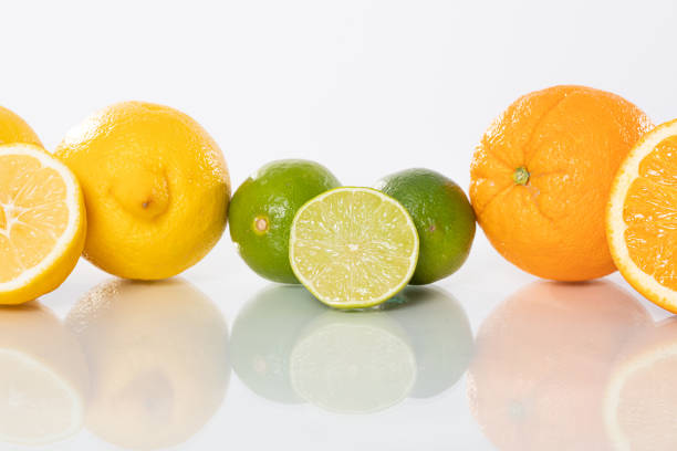 Mixed Fruits Isolated White Background Tropical Mangoes and Oranges Tangerine Cut Slices in Basket