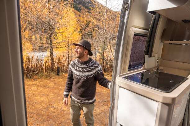 istock Man Enjoying Autumn by Camper Van 2184178386