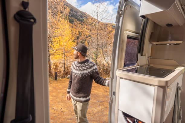 istock Man Enjoying Autumn by Camper Van 2184178456
