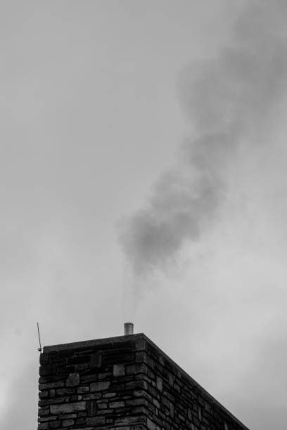 istock smoke from the chimney in black and white 2184180290