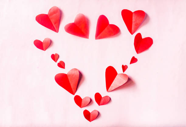 istock red hearts valentine's day ornament on pink background 2184181769
