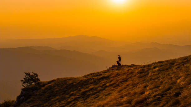 istock Serene Sunset Hike with Loyal Companion 2184183105