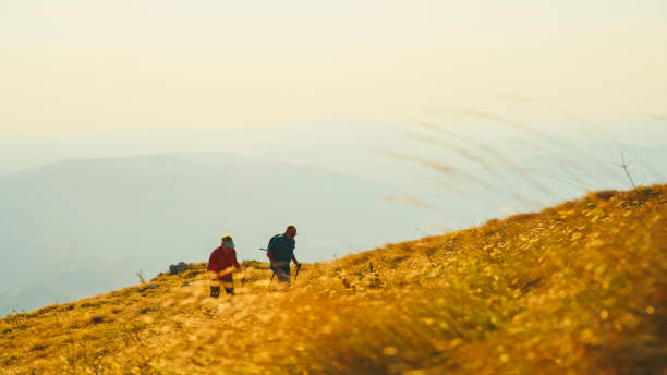 istock Active Elderly Caucasian Couple Hiking in Nature 2184183312