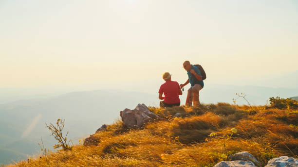 istock Senior Couple Appreciates Mountain Sunset on Hike 2184183333
