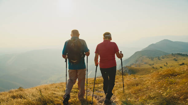 istock Active Senior Couple on Mountain Trail 2184183342