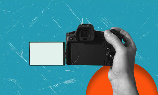 istock Modern art art collage showing hands holding a modern video camera on blue background. 2184183492