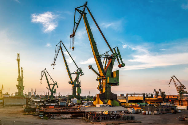 istock Working industrial port cranes at sunset 2184185728