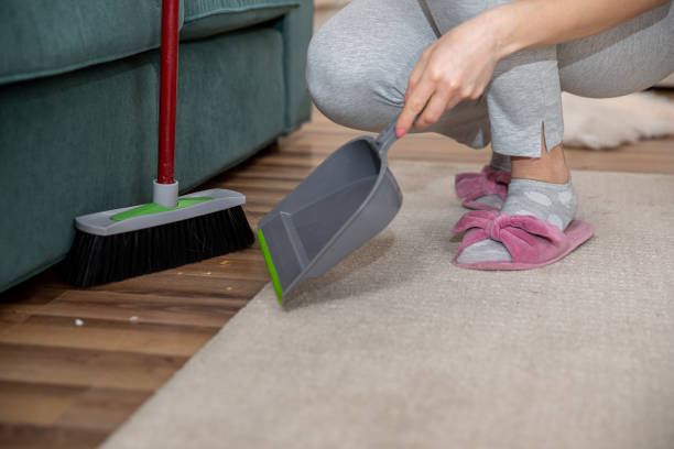 istock Cleaning Home Engaging in a Sweeping and Dustpan Action for a Tidy Environment and Comfort 2184187441