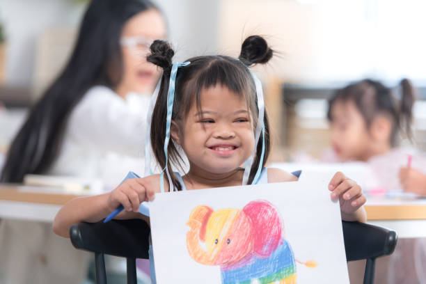 istock Portrait of special students doing learning activities in a special classroom 2184187499
