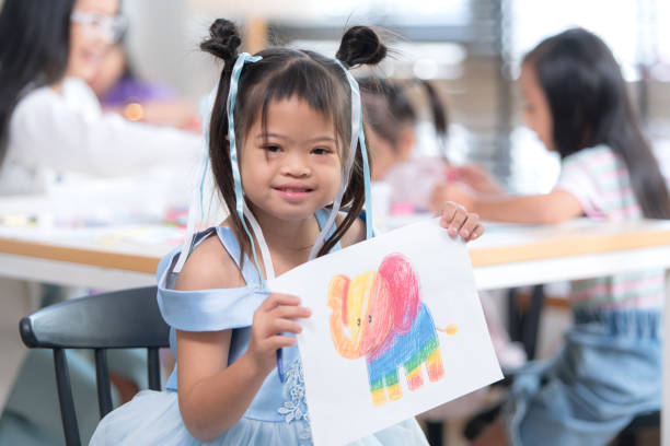 istock Portrait of special students doing learning activities in a special classroom 2184187501