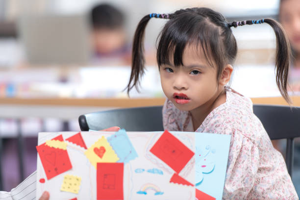 istock Portrait of special students doing learning activities in a special classroom 2184187546
