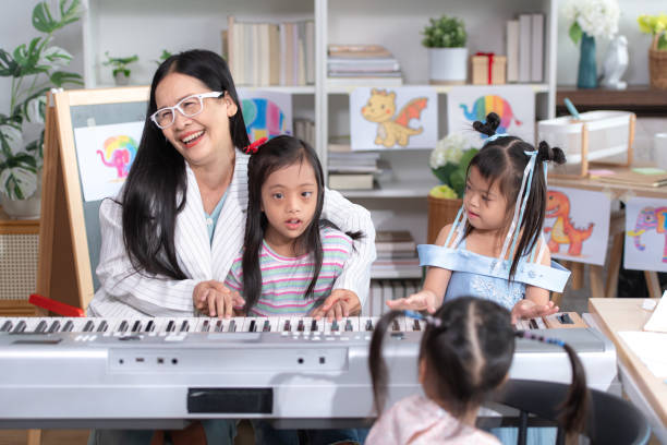 istock A group of special students doing learning activities in a special classroom 2184187617