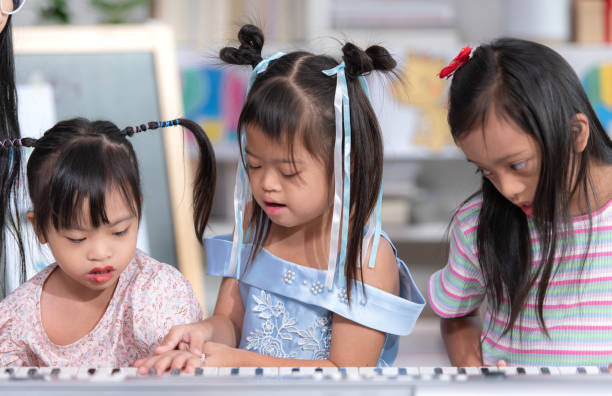 istock Portrait of special students doing learning activities in a special classroom 2184187630