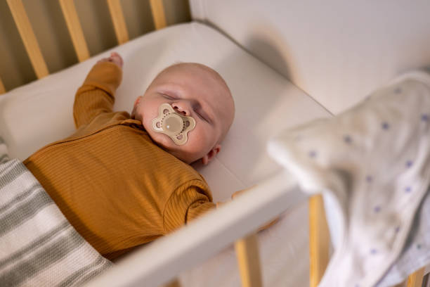 istock Newborn Baby Taking A Nap 2184187700