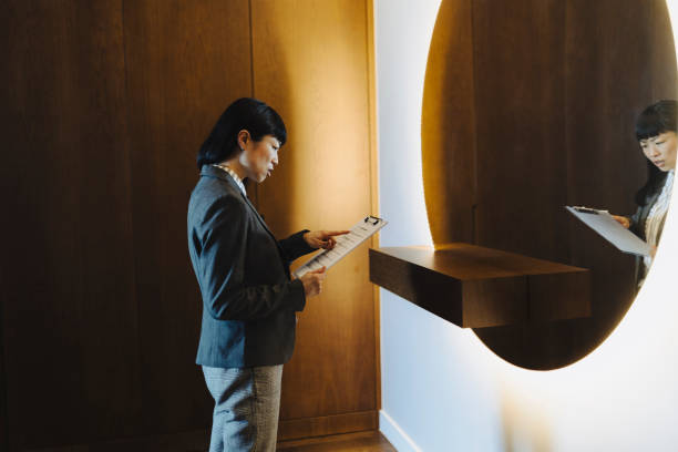 istock One woman rehearsing a speech in mirror at home 2184188507