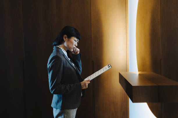 istock One woman rehearsing a speech in mirror at home 2184189053