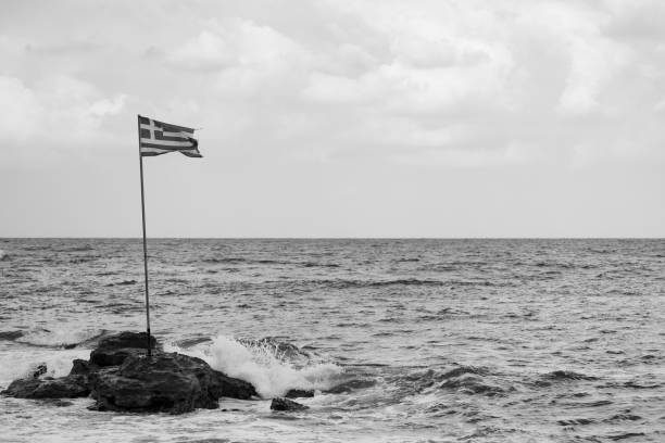 istock Waves Crash Agaisnt Beach Stones on Greek Shoreline 2184191206