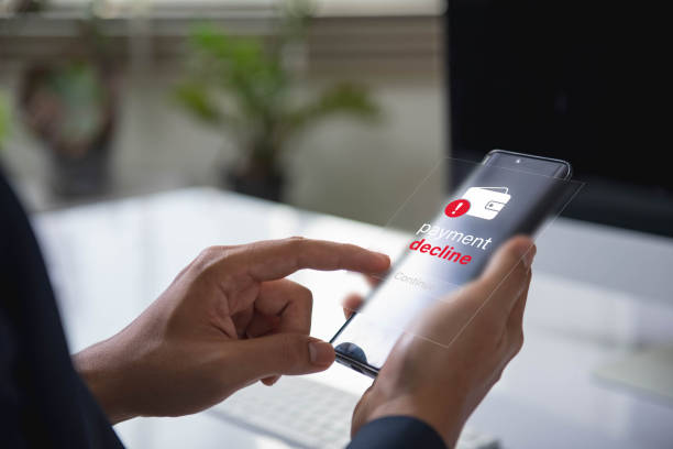 istock Declined Payment Alert, Digital Notification on Mobile Phone Showing Transaction Failure with Red Exclamation Icon, Emphasizing Financial Security and Technology Challenges 2184191742