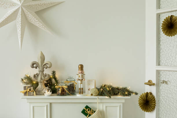 istock Elegant holiday mantel decor with a nutcracker, garland, and fleur-de-lis ornament. A cozy setup that brings a festive spirit to the room. 2184192522