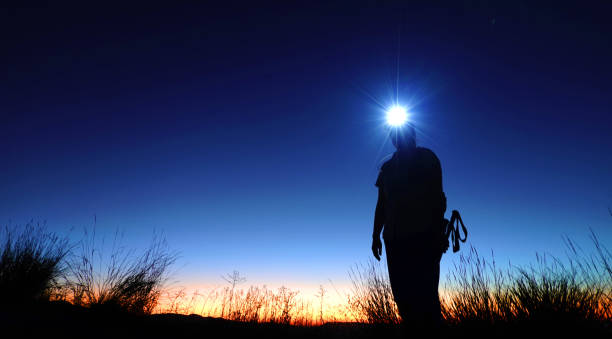 istock Hiking at Twilight or Dusk with a Headlamp in Mountains 2184192956