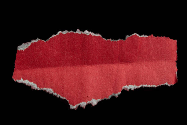 istock Ripped torn red paper piece isolated on black background 2184193065