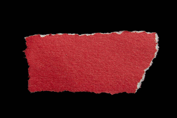 istock Ripped torn red paper piece isolated on black background 2184193076