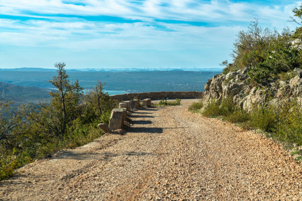 The Master's Road, half-asphalted, half-macadam 41-kilometer-long Majstorska cesta in Velebit.  One of the most beautiful tourist attractions in Croatia. Build 200 hundred years ago. Tula's crags are a karst formations on Velebit , dirt road.