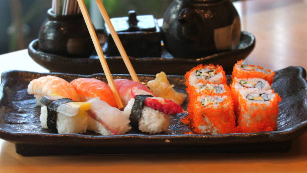 Beautifully arranged sushi platter with nigiri and maki rolls, authentic Japanese cuisine. Japanese Food and Culinary Art