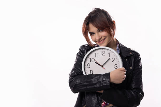 A joyful person embracing a large clock, representing the vital importance of effective time management and planning